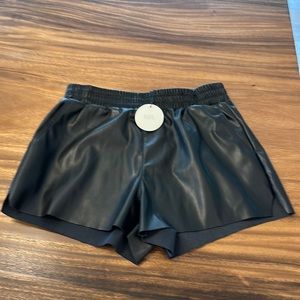 NIA size M faux leather shorts w/ pockets & elastic waist.